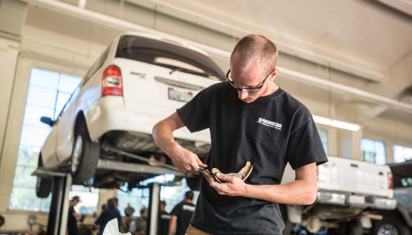 SBCC Automotive student working on a part.